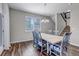 A dining room with lots of natural light coming in the large window at 3945 John Ave, Castle Rock, CO 80104