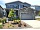 Beautiful two-story home featuring stone accents, an attached two-car garage, and a well-maintained front yard at 3945 John Ave, Castle Rock, CO 80104