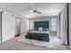 Spacious main bedroom featuring a tufted headboard, ceiling fan, and access to a private balcony at 3945 John Ave, Castle Rock, CO 80104