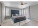 Main bedroom boasting a large bed, access to a private balcony, and an abundance of natural light at 3945 John Ave, Castle Rock, CO 80104