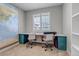 Bright office space with large desk and built in shelving, perfect for working from home at 3945 John Ave, Castle Rock, CO 80104