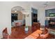 Charming dining area with hardwood floors, pendant lighting, and seamless flow to the kitchen and living room at 9338 W 107Th Mews, Westminster, CO 80021