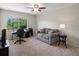 Versatile office space with a comfortable couch, large window, and functional work area at 9338 W 107Th Mews, Westminster, CO 80021
