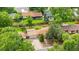 Charming single-story home with mature trees, a driveway, and a large, fenced backyard at 1235 S Benton St, Lakewood, CO 80232