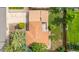 Aerial view of home showcasing roof, driveway, and surrounding landscaping at 1235 S Benton St, Lakewood, CO 80232