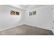 Bright bedroom features neutral carpet and two windows providing plenty of natural light at 1235 S Benton St, Lakewood, CO 80232