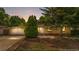 Charming single-story home with brick facade, well-manicured landscaping, and attached garage at 1235 S Benton St, Lakewood, CO 80232