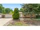 Charming home with a well-maintained front yard and an attached garage at 1235 S Benton St, Lakewood, CO 80232