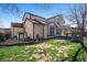 Backyard featuring a well-maintained lawn, patio, and privacy fence creating a private oasis at 19232 E Adriatic Pl, Aurora, CO 80013