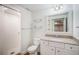 Clean bathroom with white tile shower, granite countertop vanity, and modern fixtures at 19232 E Adriatic Pl, Aurora, CO 80013