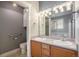 Bathroom featuring double sinks, light fixtures, and an adjacent bathtub at 19232 E Adriatic Pl, Aurora, CO 80013