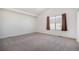 Bright bedroom with vaulted ceilings, neutral carpet, and a window for natural light at 19232 E Adriatic Pl, Aurora, CO 80013