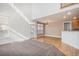 Bright living room with hardwood floors, and an open layout connecting to the kitchen at 19232 E Adriatic Pl, Aurora, CO 80013