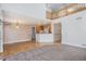 Spacious living room featuring hardwood floors, and an open layout connecting to the kitchen at 19232 E Adriatic Pl, Aurora, CO 80013