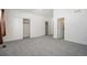 Spacious main bedroom featuring plush carpeting and ample closet space at 19232 E Adriatic Pl, Aurora, CO 80013