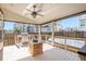 Covered patio featuring an outdoor kitchen, ceiling fan, and ample space for entertaining at 19232 E Adriatic Pl, Aurora, CO 80013
