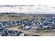 A dynamic aerial view showcasing the neighborhood's layout and mountain views at 1308 E Hopkins Dr, Elizabeth, CO 80107