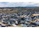 A beautiful aerial view of the neighborhood with mountain backdrop and scenic view at 1308 E Hopkins Dr, Elizabeth, CO 80107