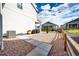 A spacious backyard features a patio with outdoor seating, lush landscaping, and a privacy fence for relaxation at 1308 E Hopkins Dr, Elizabeth, CO 80107