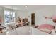 Bright bedroom featuring a swing chair, desk, and closet with neutral finishes at 1308 E Hopkins Dr, Elizabeth, CO 80107