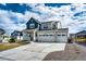 Beautiful two-story home with a three-car garage and well-maintained landscaping at 1308 E Hopkins Dr, Elizabeth, CO 80107