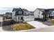 Charming two-story home with a three-car garage and landscaped front yard at 1308 E Hopkins Dr, Elizabeth, CO 80107