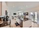 Spacious kitchen featuring white cabinets, a center island, and an open layout to the living area at 1308 E Hopkins Dr, Elizabeth, CO 80107