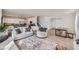 Open-concept living space featuring a modern kitchen, living room and dining area at 1308 E Hopkins Dr, Elizabeth, CO 80107