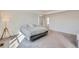 Serene main bedroom with tray ceiling, plush carpet, and a comfortable bed, bright and airy at 1308 E Hopkins Dr, Elizabeth, CO 80107