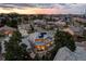 Aerial view of a residential neighborhood featuring many houses, trees, streets, and blue sky at 6728 S Catawba Way, Aurora, CO 80016