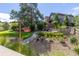 Backyard featuring mature trees, a stone patio, and lush landscaping, perfect for outdoor enjoyment at 6728 S Catawba Way, Aurora, CO 80016