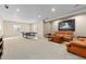 Finished basement includes carpeting, recessed lighting, a seating area, and ping pong table for entertainment at 6728 S Catawba Way, Aurora, CO 80016