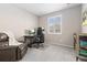 Home office space features a workstation, leather chair, and large window providing natural light at 6728 S Catawba Way, Aurora, CO 80016