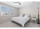 Bright bedroom with ample lighting featuring a ceiling fan, plantation shutters, and neutral décor at 6728 S Catawba Way, Aurora, CO 80016
