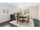 Elegant dining room with tray ceiling, plantation shutters, and stylish furniture at 6728 S Catawba Way, Aurora, CO 80016
