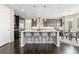 Modern kitchen with granite countertops, stainless steel appliances, and a large center island at 6728 S Catawba Way, Aurora, CO 80016
