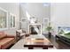 Cozy living room with a stone fireplace, plush seating, and an entertainment center at 6728 S Catawba Way, Aurora, CO 80016
