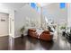 Expansive living room featuring high ceilings, large windows, and a comfortable leather sofa at 6728 S Catawba Way, Aurora, CO 80016