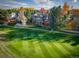 Luxury home on golf course with mature trees in fall colors at 98 Glenmoor Ln, Cherry Hills Village, CO 80113