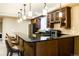 Bar area with counter seating, pendant lights, and ample counter space for entertaining at 98 Glenmoor Ln, Cherry Hills Village, CO 80113