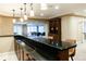 Entertainment area featuring dark countertop, bar seating, and an open floorplan at 98 Glenmoor Ln, Cherry Hills Village, CO 80113