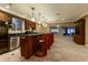 Finished basement with a wet bar and ample storage at 98 Glenmoor Ln, Cherry Hills Village, CO 80113