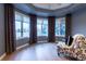 Comfortable bedroom with bay window and sitting area at 98 Glenmoor Ln, Cherry Hills Village, CO 80113