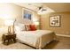 Bedroom with a ceiling fan, queen size bed, and accent pillows at 98 Glenmoor Ln, Cherry Hills Village, CO 80113