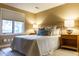 Comfortable bedroom featuring neutral tones, a cozy bed, and bright natural light from the window at 98 Glenmoor Ln, Cherry Hills Village, CO 80113