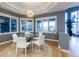 Bright dining area with large windows and modern table set at 98 Glenmoor Ln, Cherry Hills Village, CO 80113