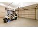 Attached garage with golf cart and ample storage at 98 Glenmoor Ln, Cherry Hills Village, CO 80113