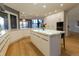 Modern kitchen with white cabinetry and large island at 98 Glenmoor Ln, Cherry Hills Village, CO 80113