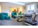 Comfortable living room featuring modern furnishings and a view of the kitchen and dining area at 98 Glenmoor Ln, Cherry Hills Village, CO 80113