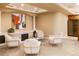 Sitting area with decorative pillars featuring matching chairs, accent lighting, and artwork at 98 Glenmoor Ln, Cherry Hills Village, CO 80113